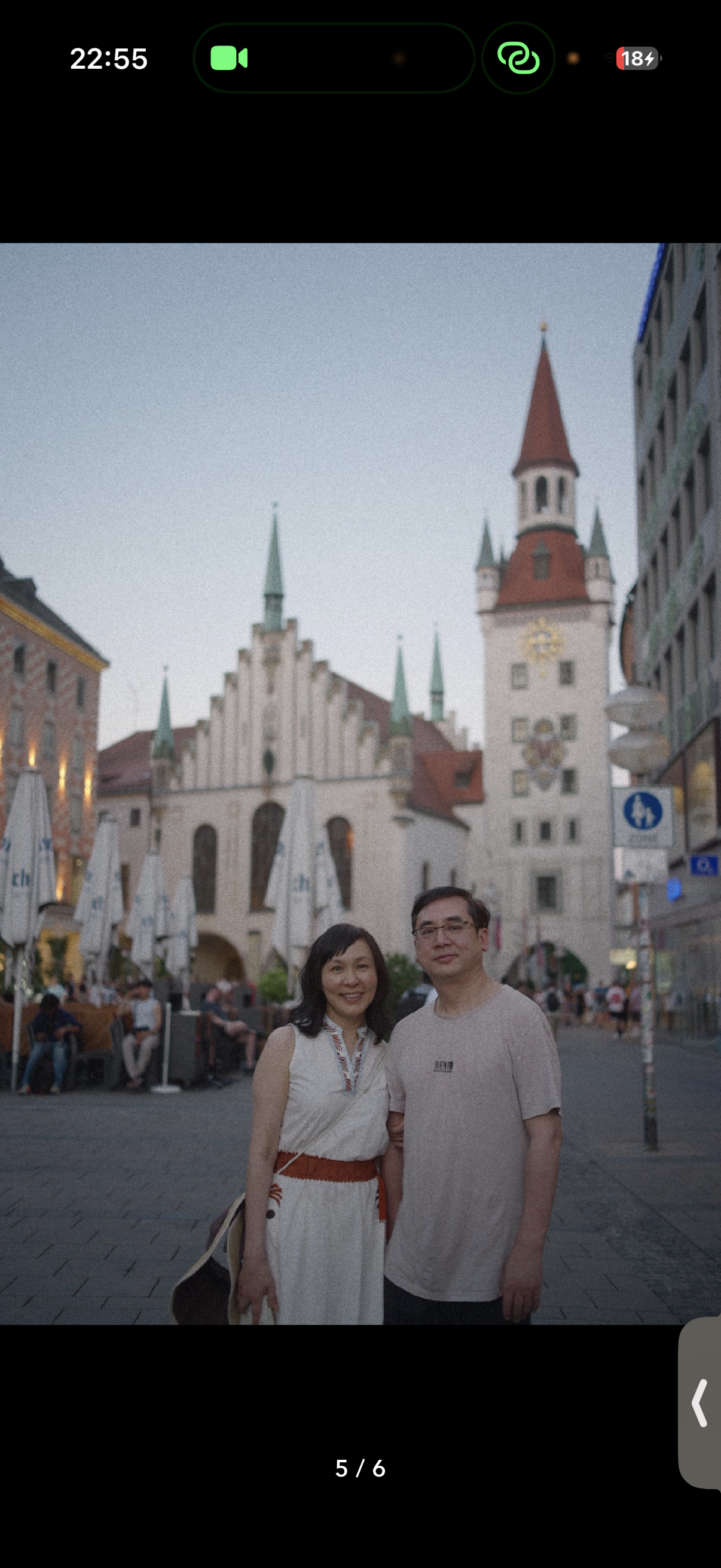 Two people in a city square.